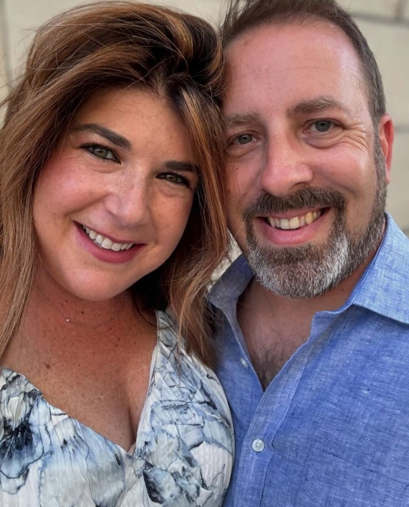 Erica and Eric smiling together in a close portrait