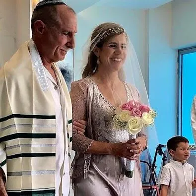 Pamela, also known as Michal, and Steve in their wedding attire